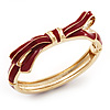 Stylish Dark Red Enamel Bow Hinged Bangle Bracelet In Gold Plated Metal - 18cm Length