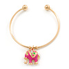 Gold Tone Slip-On Cuff Bracelet With A Deep Pink Enamel Elephant Charm - 19cm L