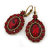 Vintage Inspired Oval Red Crystal Drop Earrings with Leverback Closure In Antique Gold Tone - 40mm L