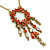 Carrot Red Diamante Round Pendant With Dangles, On 38cm L/ 7cm Ext Gold Tone Chain - view 2
